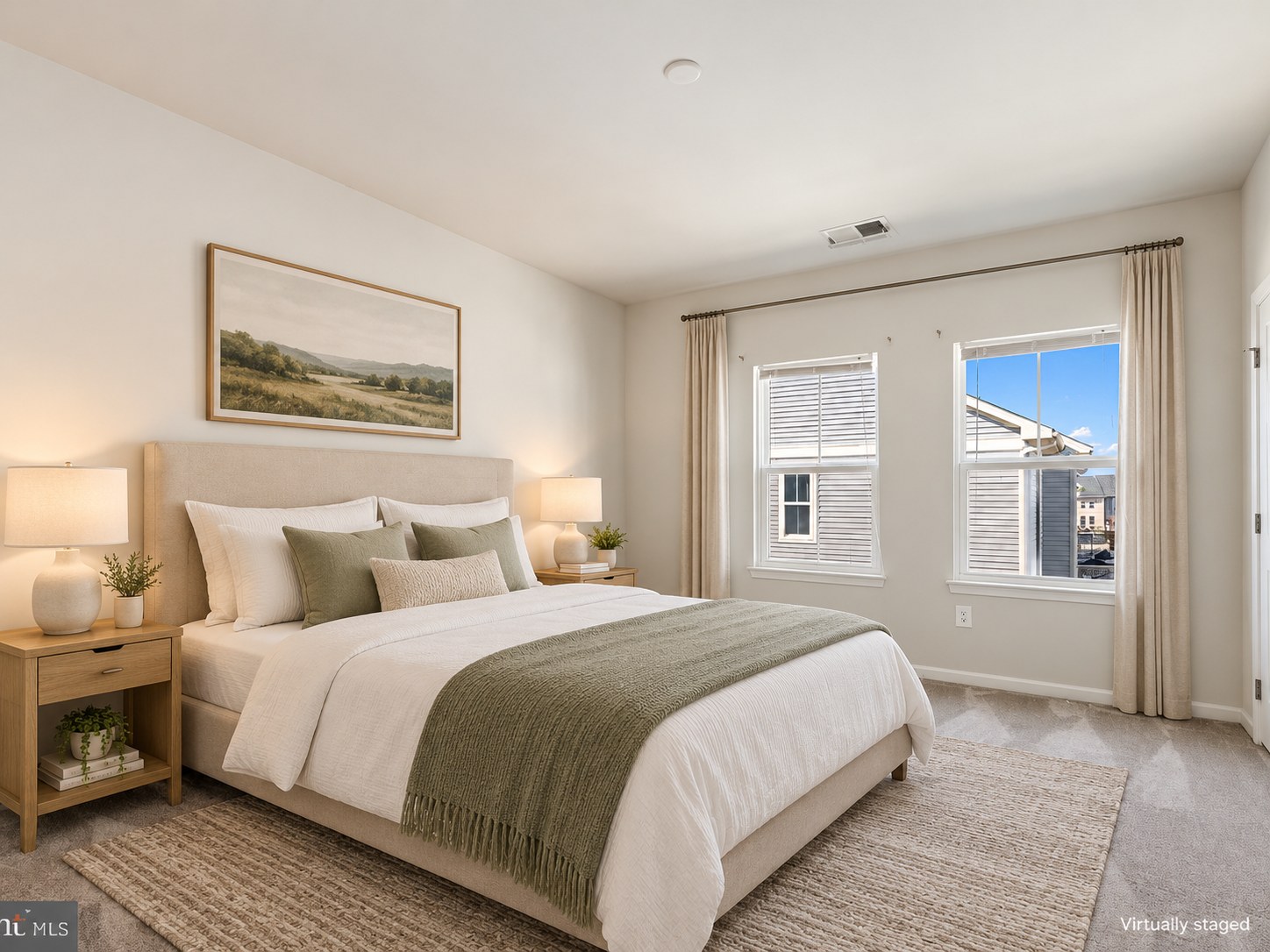 Light-filled bedroom with a bed and bedside lamp